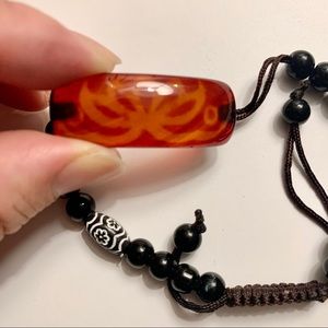 Beaded bracelet with lotus design